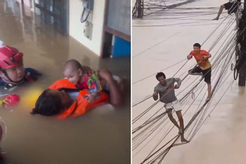 Bão lụt '300 năm có một': Phố biến thành sông, dân Thái Lan đu dây điện tránh lũ
