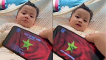 Tuyệt chiêu dỗ con của ông bố trẻ: Bé nín khóc ngay khi nghe Quốc ca