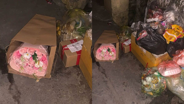 Cảnh những bó hoa đẹp bị vứt bãi rác sau 20/10 gây tranh cãi về sự lãng phí